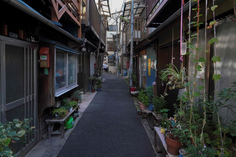 This photo taken on August 23, 2023 shows an alley in an area with dense wooden houses in Arakawa Ward, Tokyo. — eNM pic