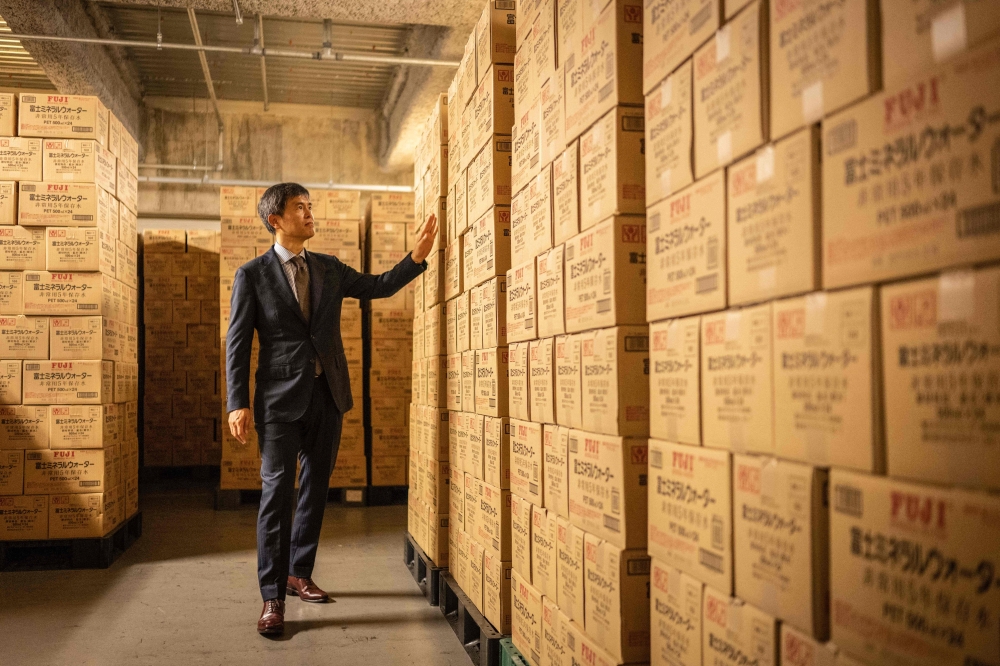 Takashi Hosoda, head of disaster management at Mori Building, posing for photographs at the emergency supply warehouse of Roppongi Hills Mori Tower in Tokyo. — eNM pic