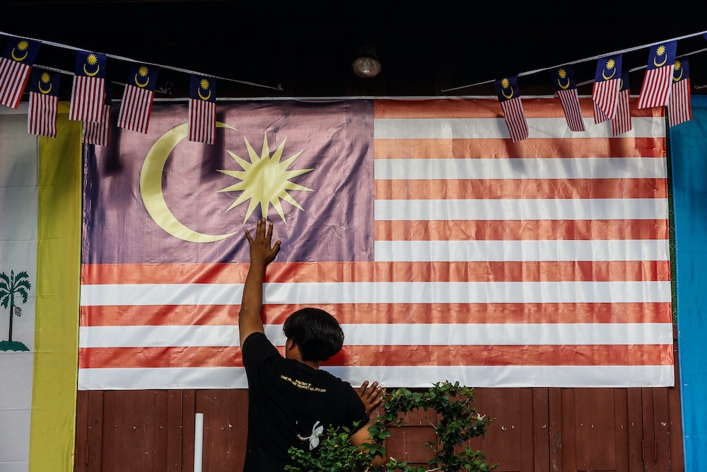 Under Article 19, the Malaysian government may choose to approve applications to be a naturalised citizen if satisfied that the applicant aged at least 21 is of ‘good character’, has ‘adequate knowledge’ of the Malay language, has lived in Malaysia at least 10 years — within 12 years before the application — and intends to live permanently in Malaysia if naturalised. — Picture by Sayuti Zainudin