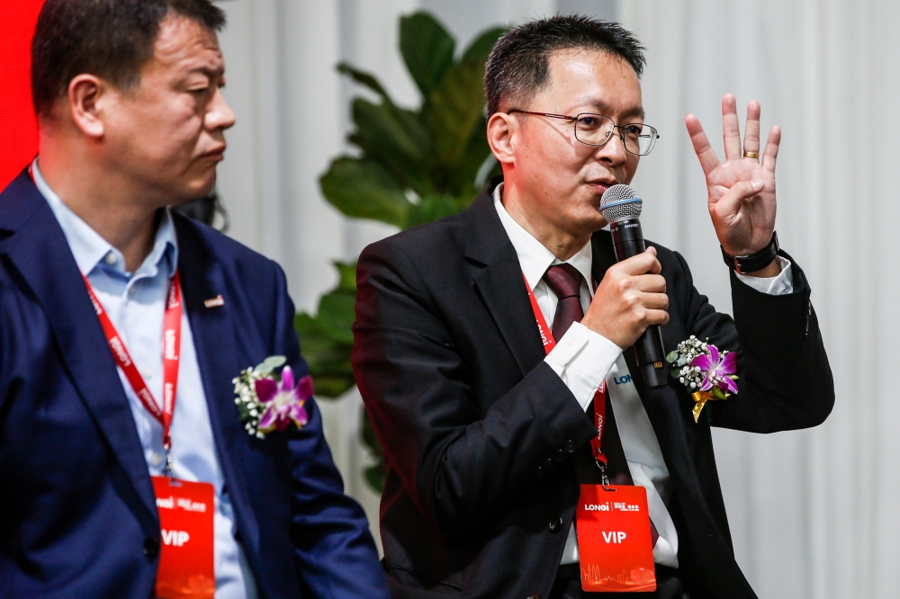LONGi vice president of International Manufacturing Centre Sii Jing Ngieng (right) speaks during a press conference in Rawang October 17, 2023. 