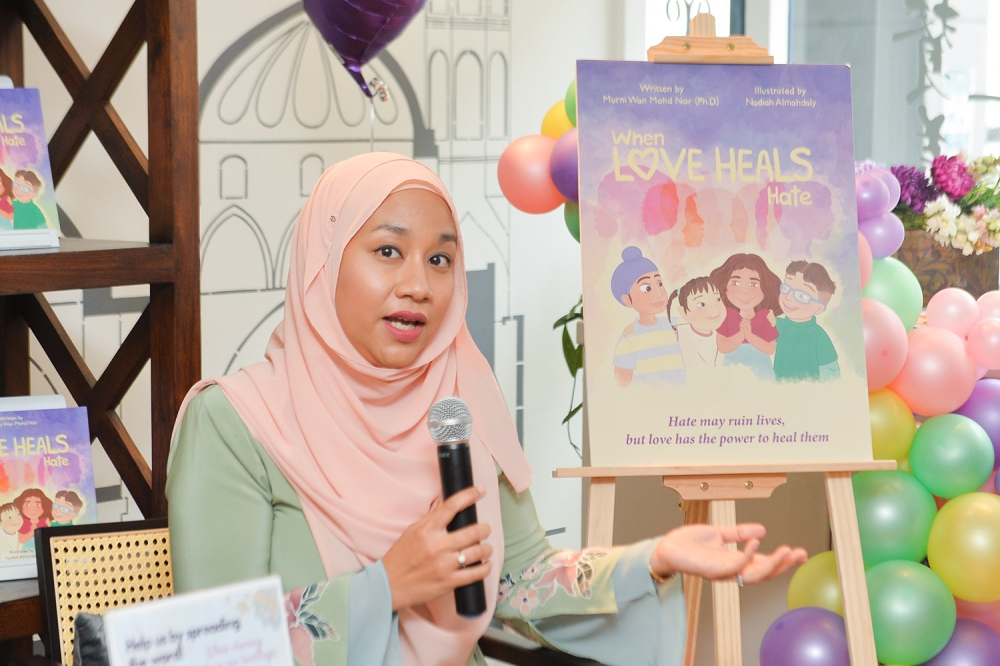 ‘When Love Heals Hate’ book author Murni Wan Mohd Nor speaks during the launch of the book in Kuala Lumpur November 11, 2023. — Picture by Miera Zulyana