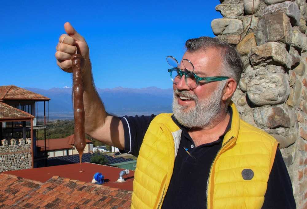 George Piradashvili, hotelier, vineyard owner and producer of the churchkhela delicacy, a Georgian sweet snack made from leftover grape juice, flour and walnuts, poses for a picture in the city of Telavi, Georgia, October 8, 2023. — eNM pic 