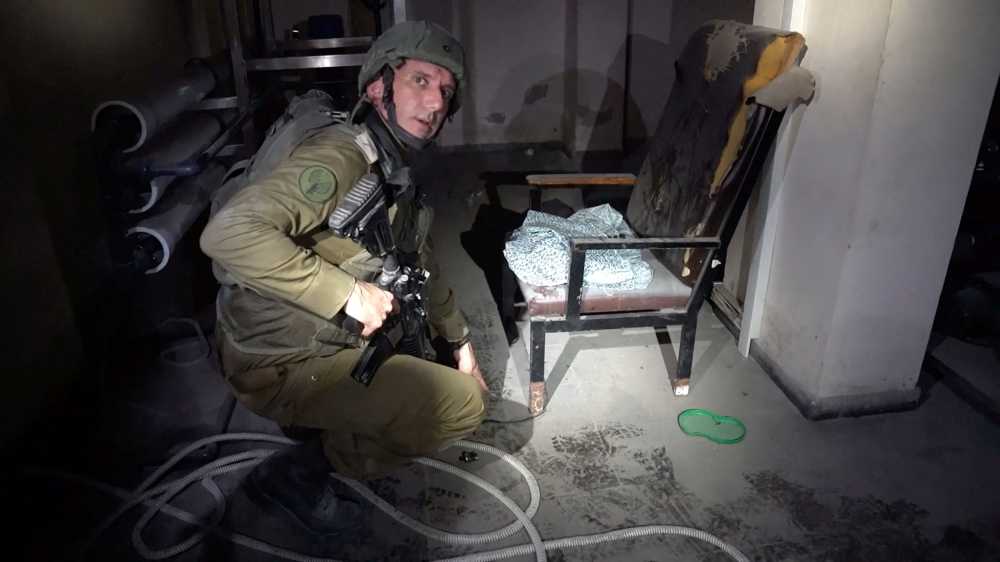 Israeli military spokesperson Rear Admiral Daniel Hagari points at a rope around the leg of a chair with women's clothing lying on the seat in the basement of Rantissi Hospital, a paediatric hospital with a specialty in treating cancer patients, at a location given as Gaza, in this still image taken from video released November 13, 2023. — Picture by Israel Defence Forces/Handout via eNM