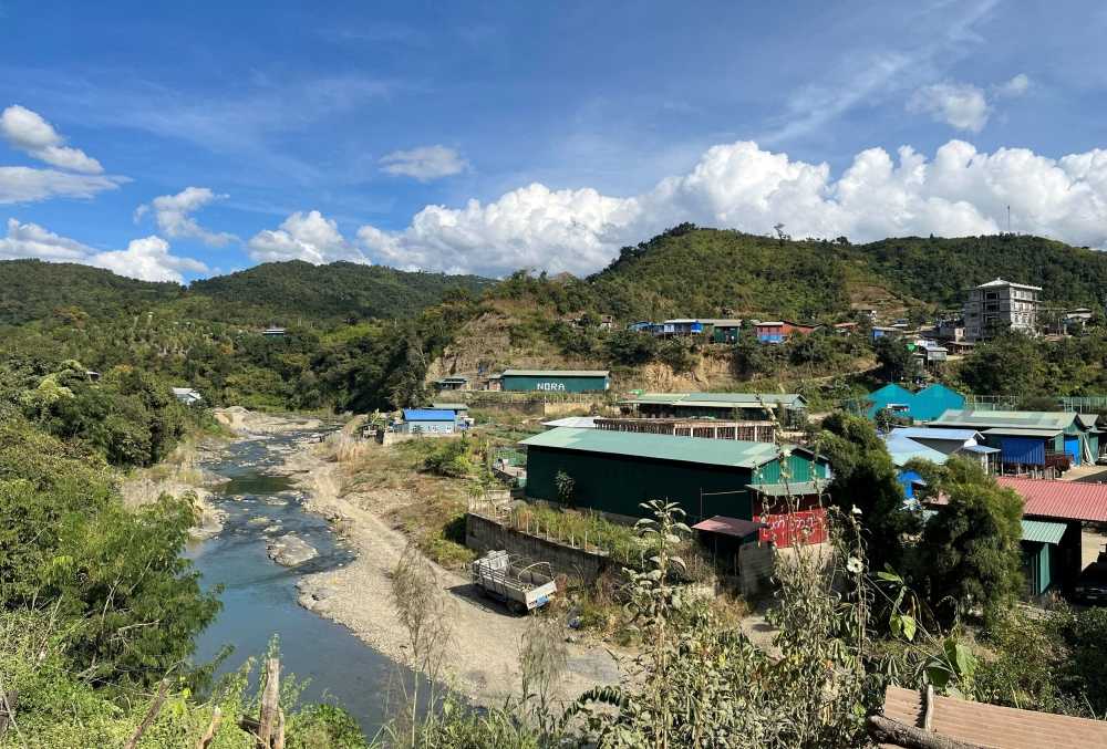 A view of Myanmar's Khawmawi village on the India-Myanmar border across the Tiau river as seen from Zokhawthar village in Champhai district of India's northeastern state of Mizoram, India November 14, 2023. — eNM pic