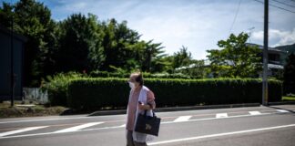  Tomoko Horino waiting for a bus to the office in Fukushima city. — eNM pic