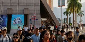 Tourists stroll through the streets of Tsim Sha Tsui, a bustling shopping hotspot, in Hong Kong December 5, 2023. — eNM pic  
