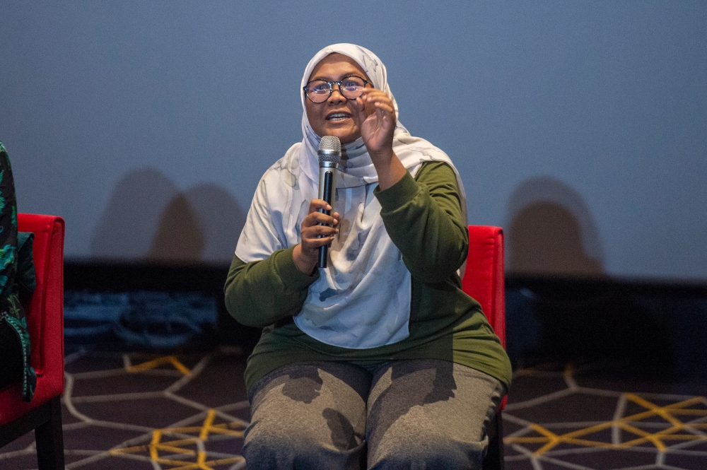 Buku Jalanan Chow Kit co-founder Siti Rahayu Baharin speaks the special screening of ‘Abang Adik’ film at Starling Mall, Petaling Jaya January 21, 2024. — Picture by Shafwan Zaidon