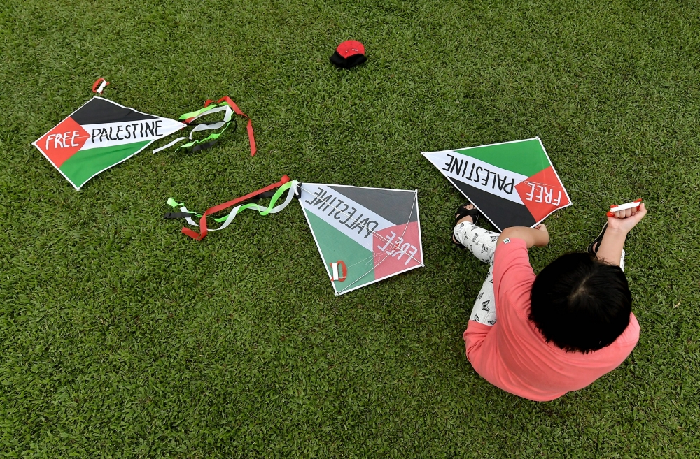 A young participant is seen with kites during the ‘Fly a Kite for Gaza’ programme in conjunction with the World Kite Day celebration at the MST Golf Driving Range @ Bukit Jelutong Golf Centre, Shah Alam January 14, 2024. — eNM pic