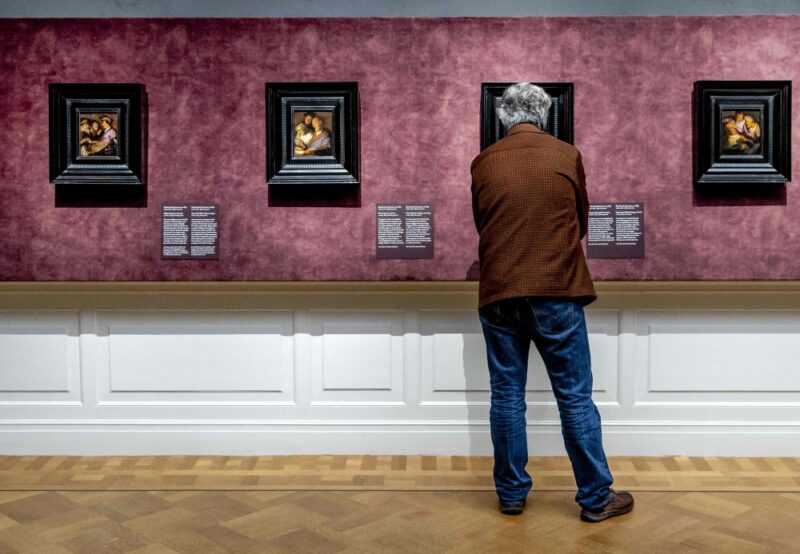 A person looks at painting during the preview of the exhibition ‘Rembrandt’s four senses — his first paintings’ in the De Lakenhal museum in Leiden January 18, 2024. The museum is celebrating its 150th anniversary and is presenting four paintings by Rembrandt that he made when he lived in Leiden as an 18-year-old. — Remko de Waal/ANP/eNM pic 