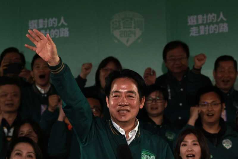 Taiwan’s President-elect Lai Ching-te (left) gestures beside his running mate Hsiao Bi-khim during a rally outside the headquarters of the Democratic Progressive Party (DPP) in Taipei on January 13, 2024, after Lai won the presidential election. — eNM pic