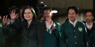 Taiwan's President Tsai Ing-wen (left) waves beside President-elect Lai Ching-te (second right) during a rally outside the headquarters of the Democratic Progressive Party (DPP) in Taipei on January 13, 2024, after Lai won the presidential election. — eNM pic
