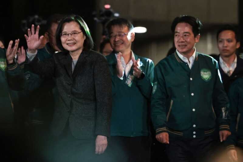 Taiwan's President Tsai Ing-wen (left) waves beside President-elect Lai Ching-te (second right) during a rally outside the headquarters of the Democratic Progressive Party (DPP) in Taipei on January 13, 2024, after Lai won the presidential election. — eNM pic