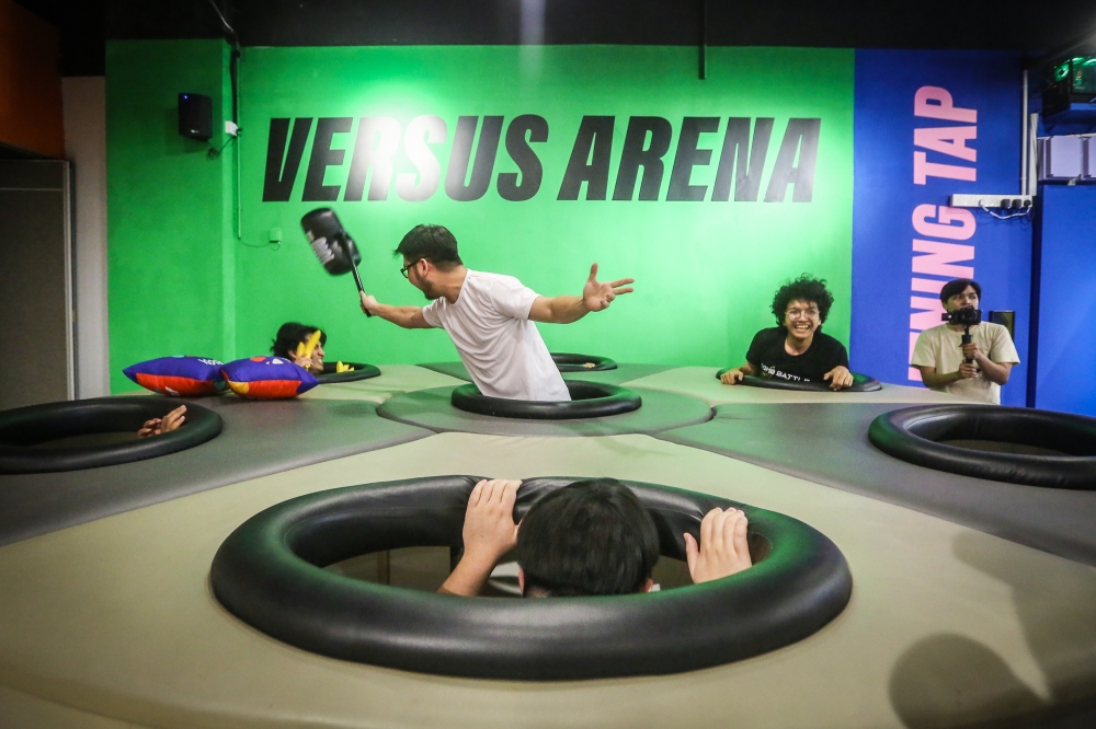 The arena-styled games at the Versus arena includes a life-size Whack-a-Mole. — Picture by Yusof Mat Isa