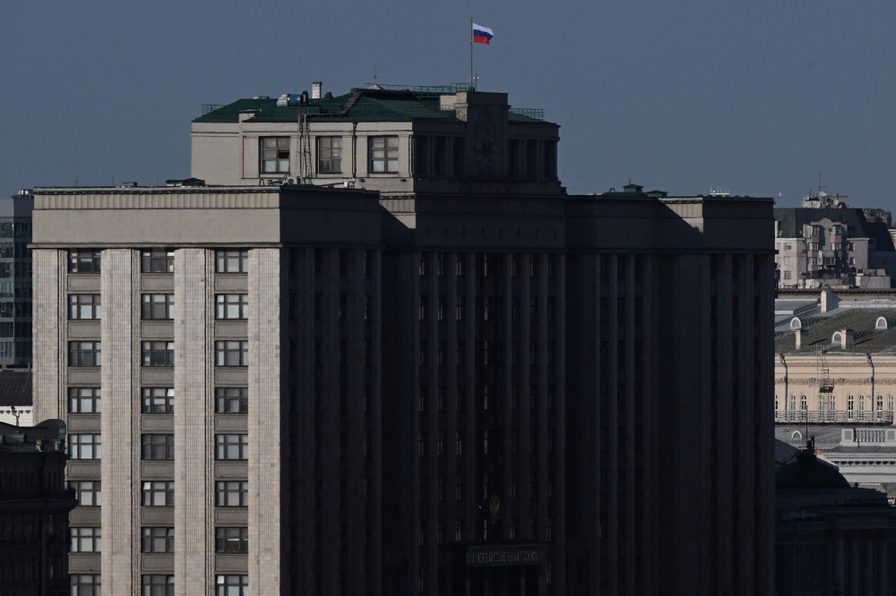 A Russian national tricolor flag tops the State Duma building, the lower house of Russia's parliament, in Moscow March 27, 2024. — eNM pic