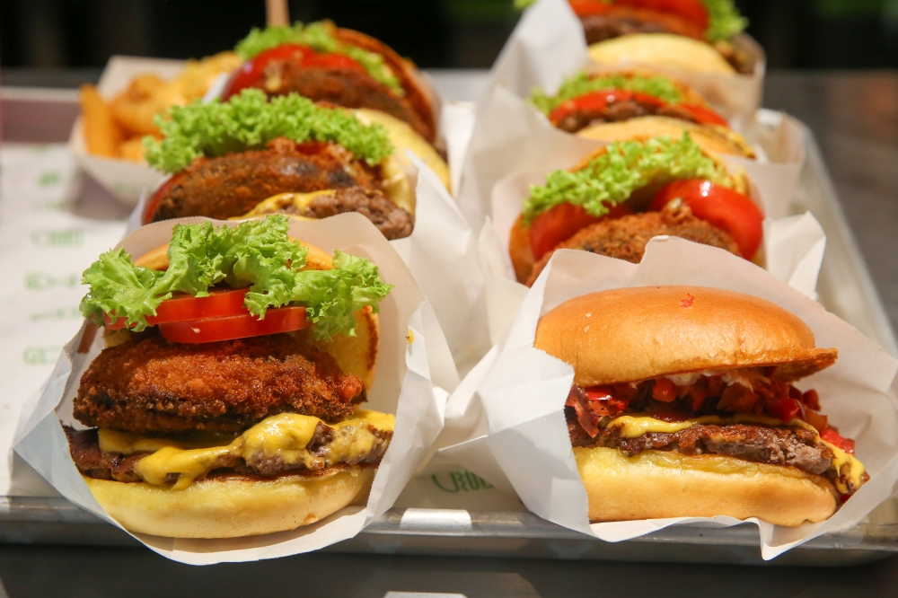 The Shake Shack menu consists of various types of beef and chicken burgers. — Picture by Choo Choy May 