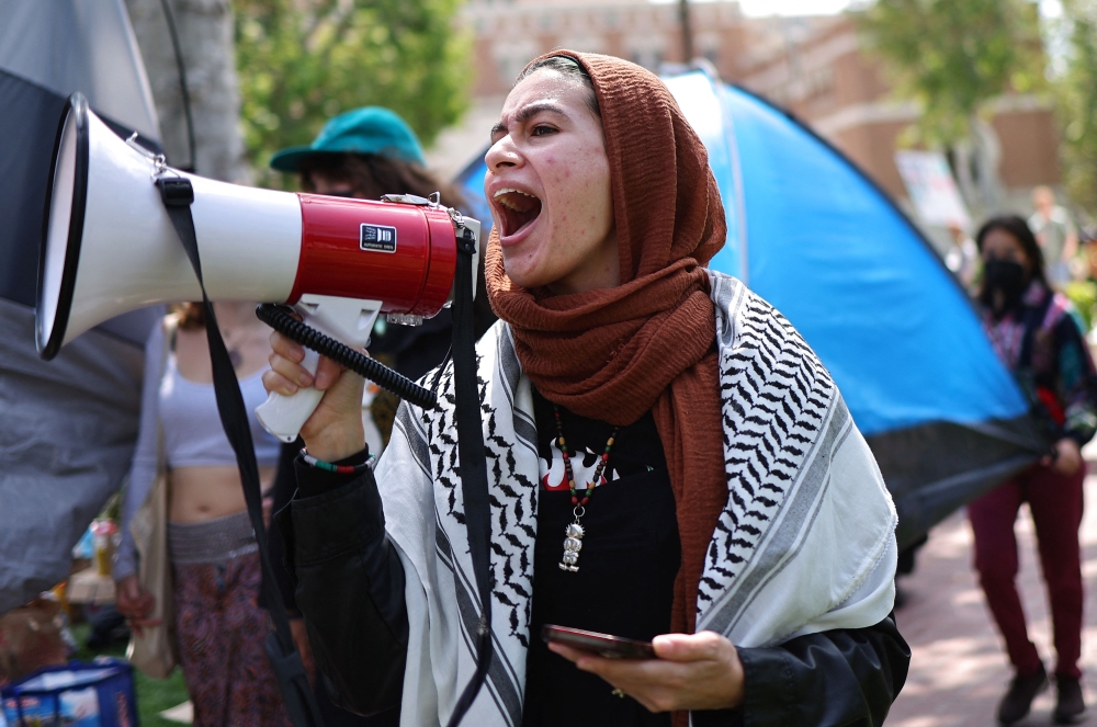 Pro-Palestine demonstrators march at an encampment in support of Gaza at the University of Southern California. — eNM pic
