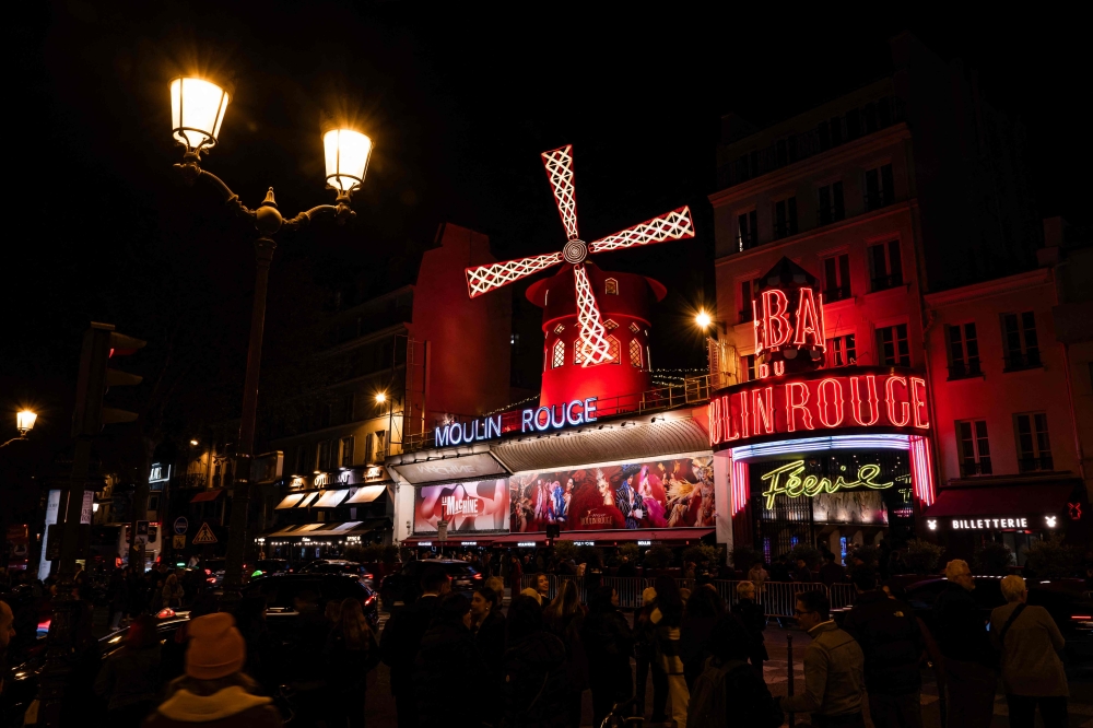 A photograph taken in Paris on April 9, 2024, shows an outside view of the Moulin Rouge musical cabaret. — eNM pic
