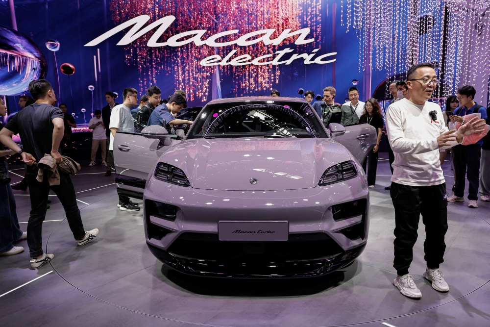 Porsche's electric vehicle Macan Turbo is displayed at its booth during the Beijing International Automotive Exhibition, or Auto China 2024, in Beijing April 25, 2024. — eNM pic  