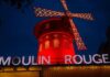 This photograph taken on October 13, 2023, shows the Moulin Rouge, a famous cabaret and theatre at night in Paris. — eNM pic