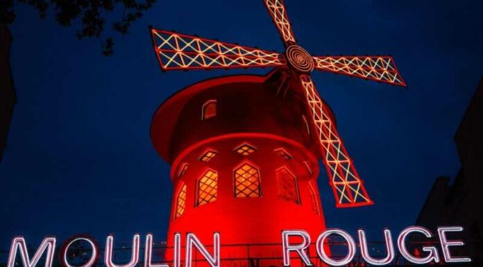 This photograph taken on October 13, 2023, shows the Moulin Rouge, a famous cabaret and theatre at night in Paris. — eNM pic