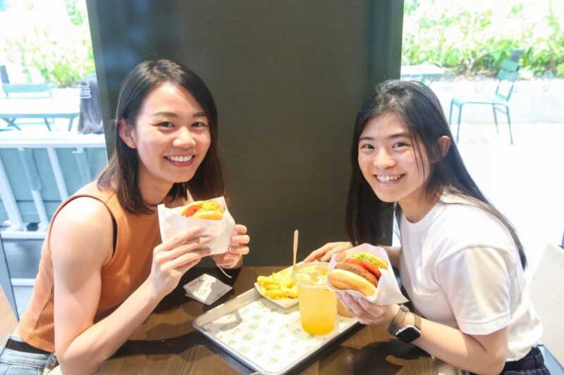Carmen Phang and Sarah Teh waited for an hour to get their favourite burger. — Picture by Choo Choy May 
