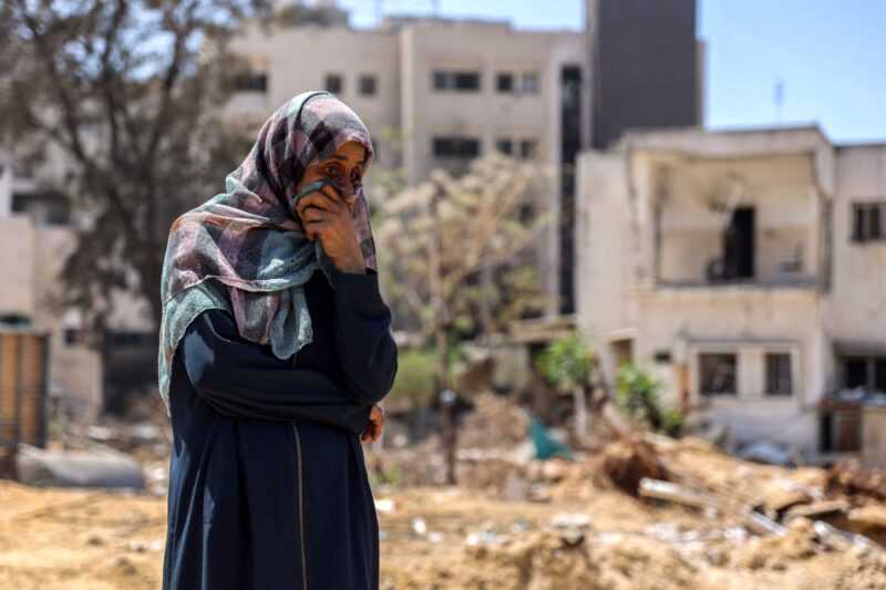 A woman reacts as she watches Palestinian forensic experts and others search for bodies of dead people in the vicinity of Al-Shifa Hospital in Gaza City on April 17, 2024 after the recent Israeli military operation there amid the ongoing fighting in the Palestinian territory between Israel and Hamas. — eNM pic