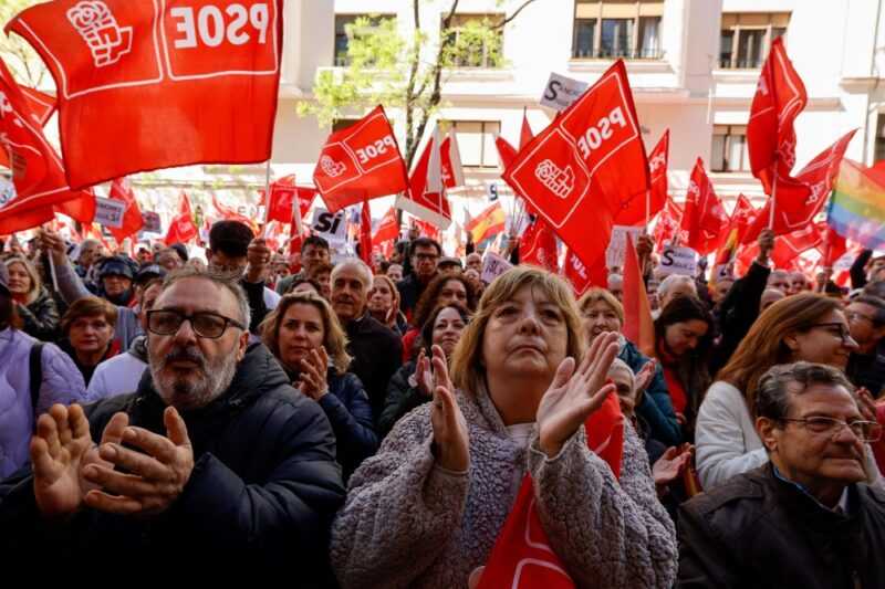 Supporters gesture and wave flags during a demonstration called in support of the Spanish Prime Minister, in front of the PSOE party headquarters in Madrid, on April 27, 2024. — eNM pic