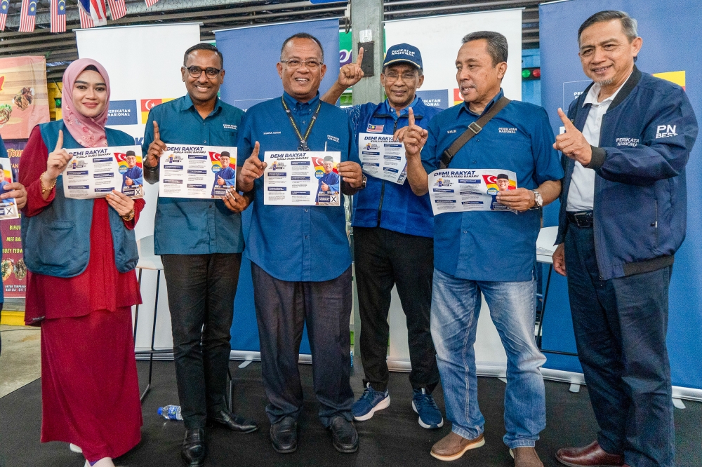 Perikatan Nasional candidate Khairul Azhari Saut and other party leaders take a group picture during the launch of PN’s manifesto for the Kuala Kubu Baru by-election in Kuala Kubu Baru on May 6, 2024. — Picture by Shafwan Zaidon