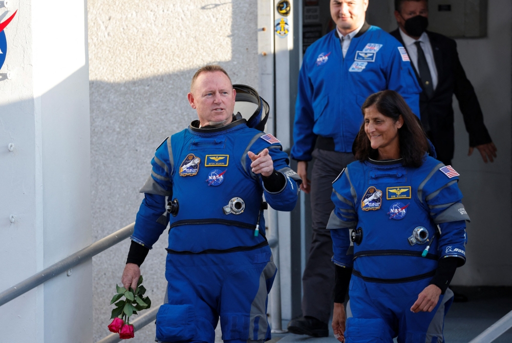 Nasa astronauts Butch Wilmore and Suni Williams walk at Nasa’s Kennedy Space Center, ahead of Boeing's Starliner-1 Crew Flight Test (CFT) mission on a United Launch Alliance Atlas V rocket to the International Space Station, in Cape Canaveral, Florida May 6, 2024. — eNM pic  