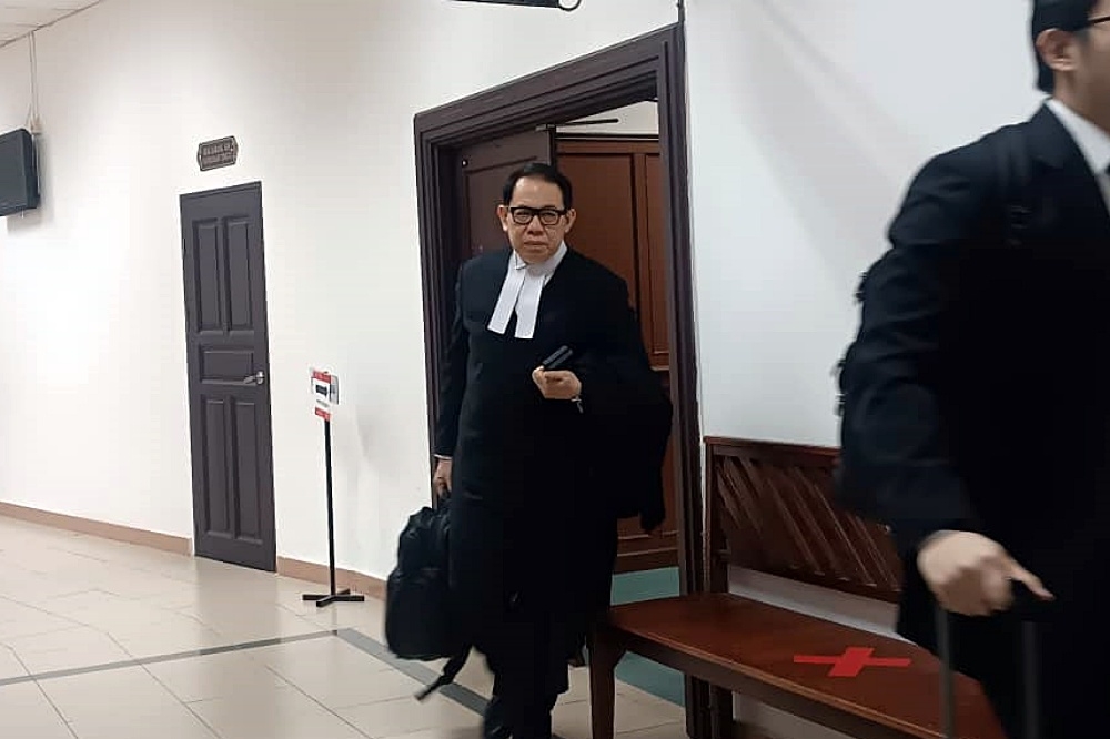 Chong exits the courtroom after the proceedings. — The eNM pic 
