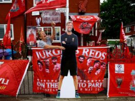 Emily Farley shouts at a passer-by as she decorates her house in Liverpool before Juergen Klopp's final match as Liverpool manager, Liverpool, Britain, May 16, 2024. — eNM pic