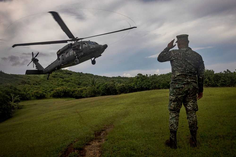 A Philippine Air Force Black Hawk helicopter lands on Itbayat island during a trip of the chief of staff of the Armed Forces of the Philippines, in Batanes, Philippines June 29, 2023. — Ezra Acayan/Pool/eNM pic