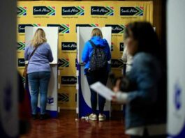 People mark their ballot papers as they vote in the South African general election, at the South African High Commission in central London on May 18, 2024. — eNM pic