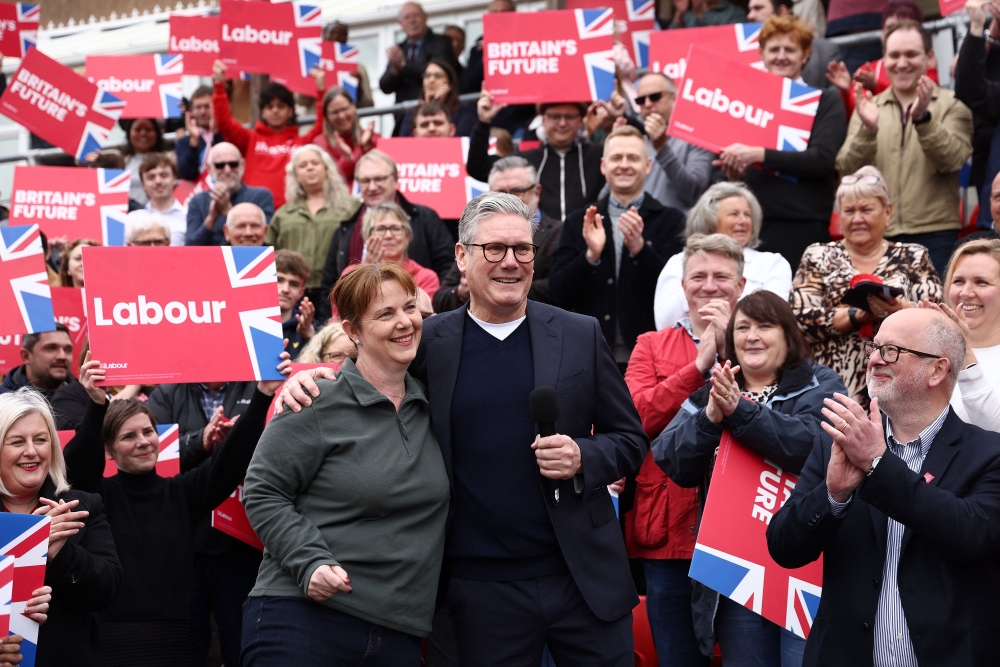 Britain’s main opposition Labour Party leader Keir Starmer embraces new East Midlands Mayor Claire Ward during a post local election rally in Mansfield, central England on May 5, 2024. ― eNM pic
