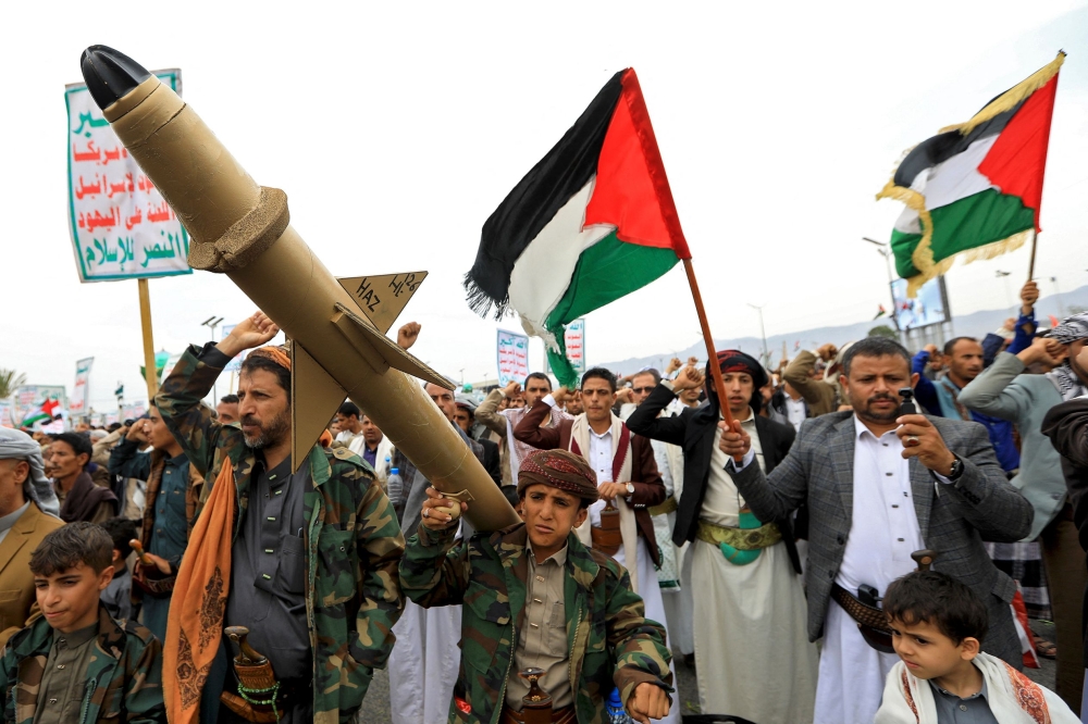 Yemenis wave Palestinian flags and hold mock rockets during a march in the Houthi-run capital Sanaa in solidarity with the people of Gaza on June 28, 2024, amid the ongoing conflict between Israel and the militant Hamas group in the Gaza Strip. — eNM pic