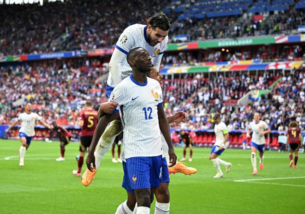 France's Randal Kolo Muani celebrates scoring their first goal with teammates. —eNM pic